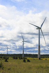 Windmills near the sea in the countryside.