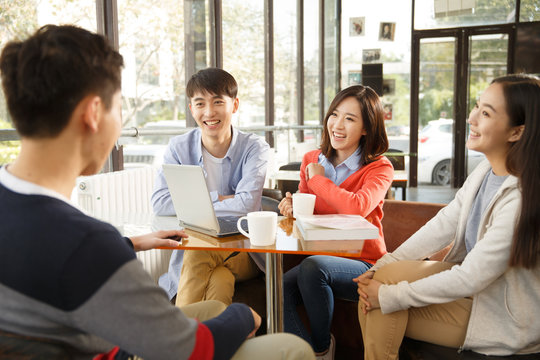 Young Men And Women In The Coffee Shop