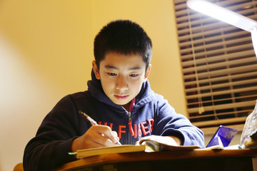 The boy study in the room