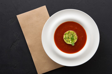 Cold tomato soup gazpacho with avocado copy space