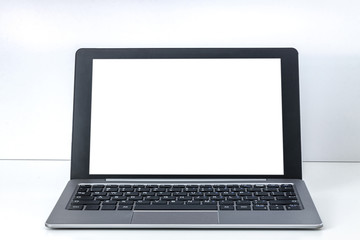 White empty desk with an open laptop