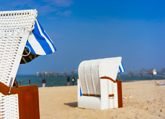 Close up of beach chairs on sandy beach on Travemuende, Luebeck Bay, Germany