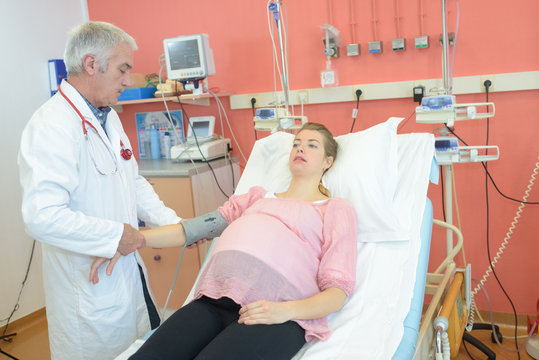 pregnant woman being monitored by the doctor