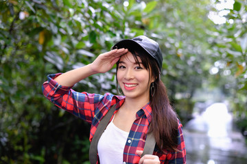 Naklejka premium Travel concept. Asian girls are traveling in the woods. Women are happily traveling.