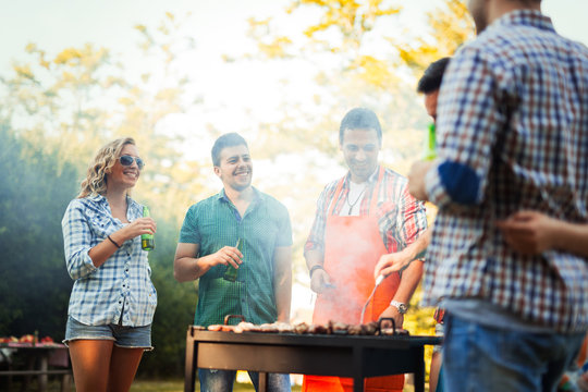 Young People Grilling Outdoors