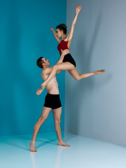 ballet dancer couple in black form performing art jump with empty copy space background, izolated