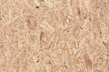 Close up of recycled compressed plywood board – texture background with copy space