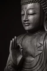 Foto op Plexiglas Boeddha Het zwart-wit beeld van gepacificeerde en verkregen verlichting Boeddha, met de hand omhoog, alsof hij tot ons zou spreken - oké.