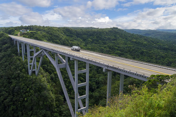 The Bakunagua Bridge is one of Cuba's attractions. The bridge's altitude is 110 meters, and its length is 103 meters.