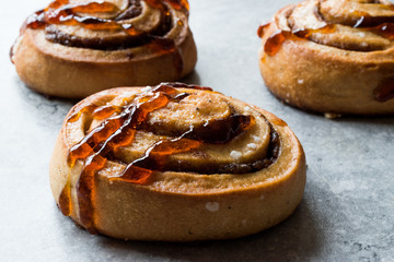 Chef Ready to Serve New York Steak with Shallot Onions and Vegetables at Restaurant Kitchen.