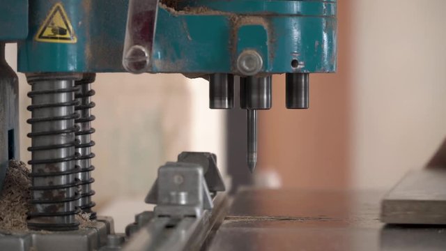 Bending flat metal then make a hole at flat bar by drilling machine. lose up tool of automatic drilling machine make hole at metal with cooling by coolant water and evaporate to steam