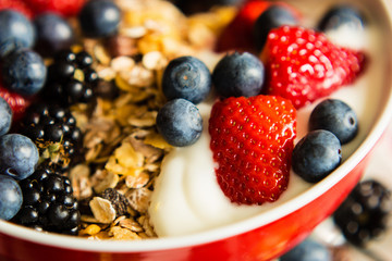 Healthy breakfast concept with oat flakes and berries