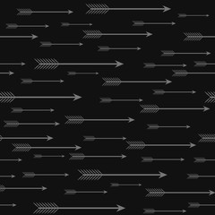 Seamless dark background with vintage arrows.