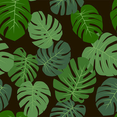 Floral tropical seamless pattern with monstera leaves on a black background. Vector. © aisedora