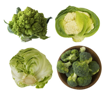 Different kinds of cabbage in a wooden bowl. Broccoli, Brussels sprouts, Roman cauliflower, green cabbage isolated on white background. Cabbage with copy space for text. 