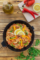 Seafood paella in a frying pan