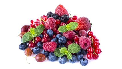 Fruits and berries isolated on white background. Ripe red currants, raspberries, blueberries,  strawberries, gooseberrie, blackberries with a mint leaf. 