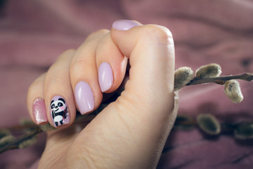 Fluffy buds and fluffy panda in the picture on a nail © iren123