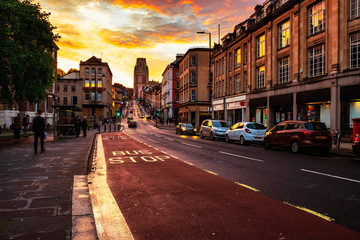 Famous street in the center of Bristol, UK in the evening during the colorful sunset - obrazy, fototapety, plakaty