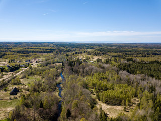 Fototapeta na wymiar drone image. aerial view of rural area with fields and forests and gravel roads seen from above