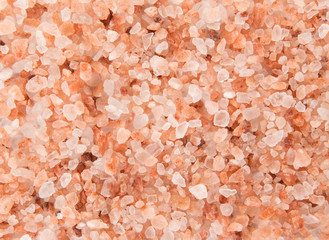 Fototapeta na wymiar Pink Himalayan coarse grain salt texture.