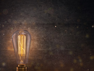 Vintage light bulb on dark background.