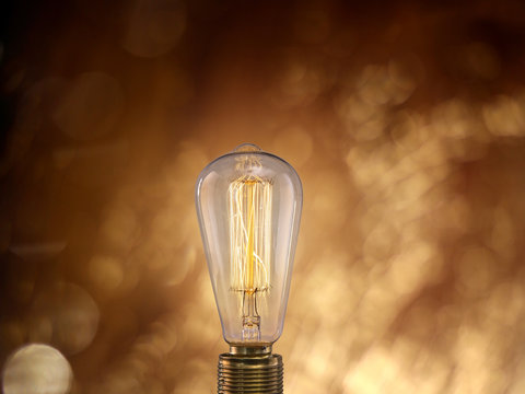 Vintage light bulb on dark background.