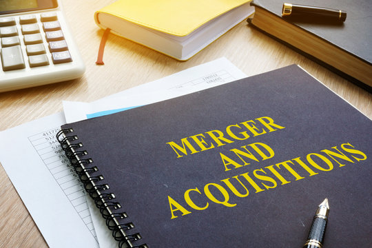 Book about Merger And Acquisitions M&A on a desk.