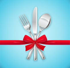 Fork, spoon, knife with red bow. Set of utensils for eating.