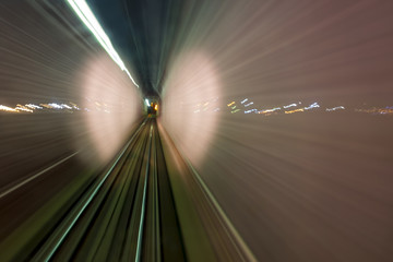 View from the cabin of the train at night. Futuristic abstract in. Fuzzy transport background.
