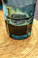 Espresso coffee on a blue transparent water glass