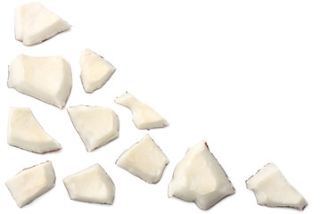 Coconut pieces isolated on white background. top view