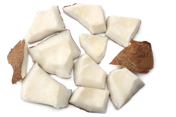 Coconut pieces isolated on white background. top view