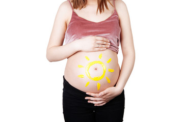 Pregnant young woman isoalted on white and drawn sun on abdomen