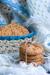 Savory cookies sprinkled with sesame seeds, sunflower on textile plaid