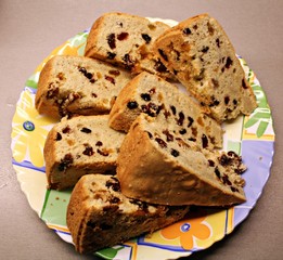 Slices of a dried fruits pie/cake  on a colorful plate.
