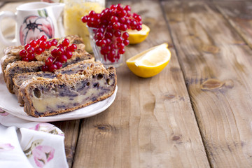 cake with lemon, nuts and berries. Delicious homemade pastries for breakfast. Place for text