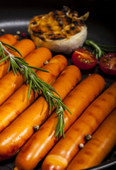 Closeup of Wiener Sausages in a pan