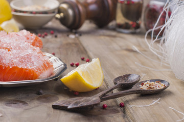 Thai food, ingredients. Rice noodles and salmon, lemon and spices. Dietary food. Stil wabi sabi. Healthy food. Wooden background. Place for text. © Marina