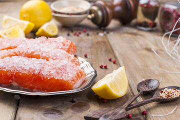 Thai food, ingredients. Rice noodles and salmon, lemon and spices. Dietary food. Stil wabi sabi. Healthy food. Wooden background. Place for text. Vertical photo