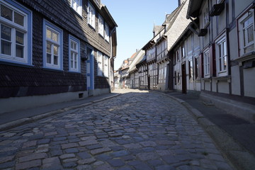 Tiny street with old nordic style houses in the town of Goslar, Germany in the Harz region.