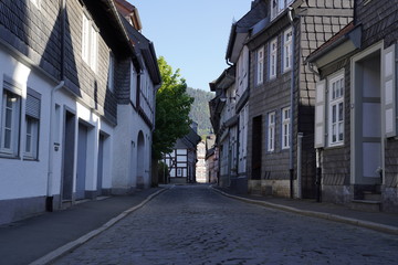 Fototapeta na wymiar Tiny street with old nordic style houses in the town of Goslar, Germany in the Harz region.