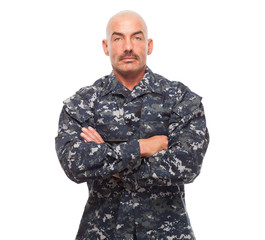 Navy man looking serious on white background.