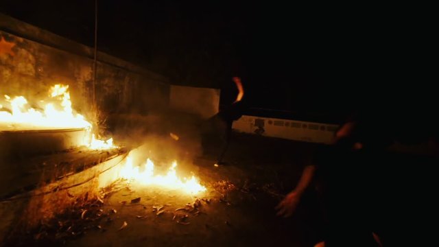 Sports Man Doing Somersault During Training Capoeira And Parkour In Night Dark