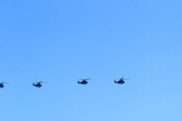 helicopters in the blue sky flying parade