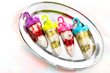 Ice cream with coconut milk, chia seeds, kiwi and strawberries