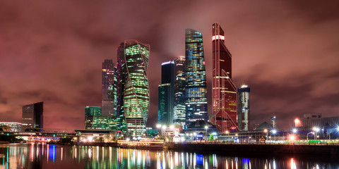 The city of Moscow at night, view from the embankment of the Moscow River to the business district. Architecture and landmark of Moscow.