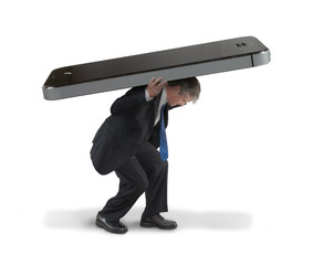 Man struggling to carry huge cell smartphone representing social media communication burnout...