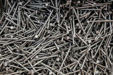 Metal steel nails in set. Fasteners for construction. Detailed background.