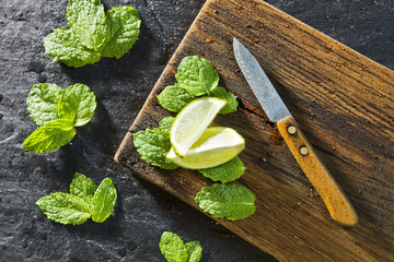 Top view with copy space lime and mint on wooden table